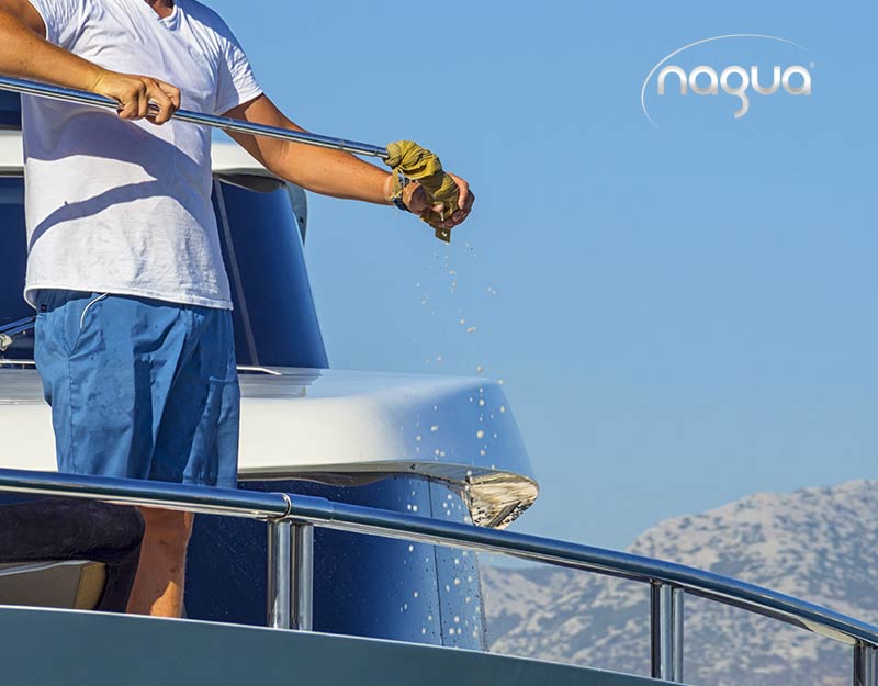 person cleaning the boat